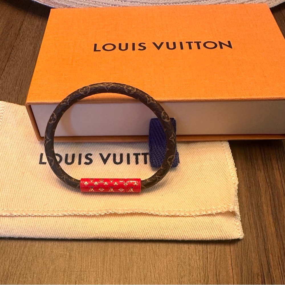 Authentic Louis Vuitton Monogram Bracelet with Red trim Size 17
